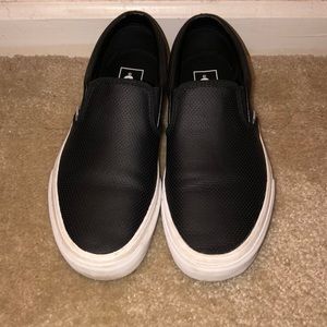 Black and white leather vans